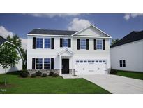 Two-story house with white siding, gray accents, and a two-car garage at 45 Calabria Ct, Franklinton, NC 27525