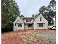 Charming new construction home featuring brick exterior, multiple windows, and a covered front porch at 8604 Windjammer Dr, Raleigh, NC 27615