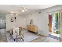 Bright living room with tiled floors and access to a patio at 108 Ephesus Church Rd # 116, Chapel Hill, NC 27517