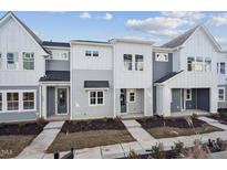 Gray and white exterior of townhouses with front porches at 602 Hillfarm Dr, Wake Forest, NC 27587