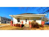 Charming house with a front porch and well-maintained yard at 1124 S Church St, Rocky Mount, NC 27803