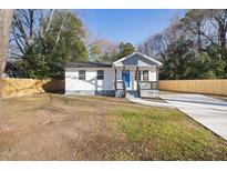 Newly built home with gray siding, white trim, and a blue door at 1209 Massey St, Smithfield, NC 27577