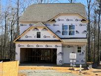 New two-story house with gray shingle roof, currently under construction at 137 Stallion Way, Benson, NC 27504