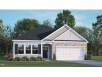 Newly constructed home with a two-car garage and landscaped yard at 155 Scenic Rock Dr, Youngsville, NC 27596