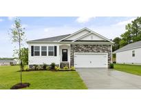 Charming single-Gathering home with stone accents, black shutters, a two-car garage, and manicured lawn at 155 Scenic Rock Dr, Youngsville, NC 27596