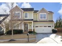Two-story house with a neutral color scheme and attached garage at 36 Aster Ln, Pittsboro, NC 27312