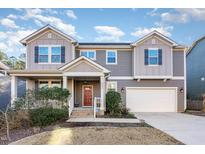 Two-story house with gray siding, red door, and attached garage at 4606 Myra Glen Place Pl, Durham, NC 27707