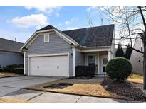 Gray exterior house with a two-car garage and well-manicured lawn at 420 Farintosh Valley Lane Ln, Durham, NC 27703