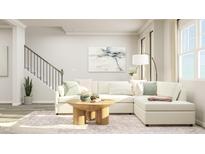 Bright living room featuring a comfy sectional sofa and a stylish coffee table at 1848 Poe Farm Ave, Apex, NC 27502