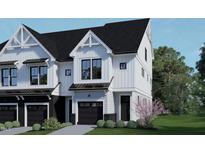 Modern two-story home with white siding and black accents at 4077 Elk Creek Ln, Raleigh, NC 27612