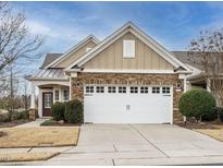 Craftsman style home with stone accents and a two-car garage at 1303 Clay Hill Way, Durham, NC 27703