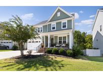 Two-story craftsman home with front porch and landscaped lawn at 296 Two Creeks Lp, Chapel Hill, NC 27517