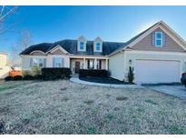 Attractive two-story home with a large front yard and attached garage at 108 Kaspurr Dr, Garner, NC 27529