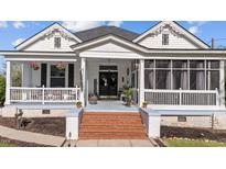 Charming front porch features brick steps, welcoming decor, and a cozy, inviting atmosphere at 400 S Boddie St, Nashville, NC 27856