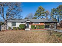 Charming ranch home with modern updates and a landscaped lawn at 1801 Liberty St, Durham, NC 27703