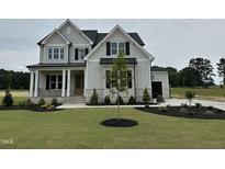 Charming two-story home with manicured lawn and landscaping at 190 Broadleaf Ln, Louisburg, NC 27549