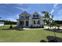 Beautiful two-story home with a manicured lawn, covered porch, and classic curb appeal at 190 Broadleaf Ln, Youngsville, NC 27596