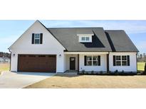 Charming new construction with a two-car garage and manicured front lawn at 24 Surles Landing Way, Benson, NC 27504