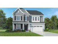 Two-story home with gray siding, stone accents, and a two-car garage at 2940 Hanging Valley Way, Wake Forest, NC 27587