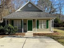 Charming craftsman style home with a green door and front porch at 415 Sowell St, Durham, NC 27701