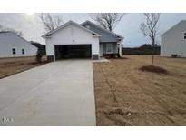 New construction home with attached garage and front yard at 7335 Pilatus Ave, Spring Hope, NC 27882