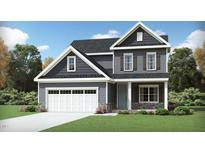 Two-story Craftsman style home with gray siding, white trim, and stone accents at 912 Thimbleweed Way, Wake Forest, NC 27587