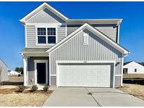 Two-story house with gray siding, white garage door, and landscaping at 1125 Centerview Drive, Nashville, NC 27856