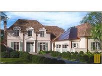 Elegant two-story home with a three-car garage and manicured landscaping at 1521 Canterbury Rd, Raleigh, NC 27608