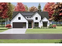 Two-story farmhouse with dark metal roof and attached garage at 2952 Forest Creek Ln, Mebane, NC 27302