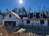 New construction home exterior; showcasing a spacious design at 30 Seahawk Way, Zebulon, NC 27597