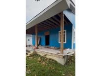 Newly painted blue home with a spacious front porch at 509 Atlantic Ave, Rocky Mount, NC 27801