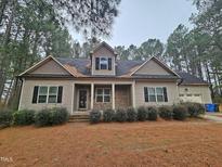 Two-story house with stone accents and a landscaped yard at 117 Majestic Dr, Princeton, NC 27569