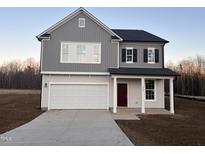 Two-story house with gray siding, white trim, and a red door at 480 Suhani Ln, Clayton, NC 27520