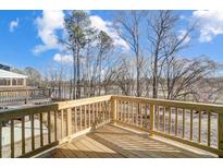 A newly constructed back deck offers a view of wooded terrain with a large, open sky at 851 Parc Townes Dr # 10, Wendell, NC 27591