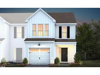 Two-story home with white siding, gray roof, and a two-car garage at 242 Broomside Ave, Raleigh, NC 27603