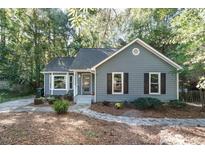 Gray house with black shutters and stone walkway at 3536 Tunas Street St, Raleigh, NC 27616