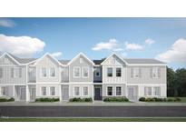 Attractive exterior of a townhome with gray siding and stone accents at 1235 Willow Tree Way, Graham, NC 27253