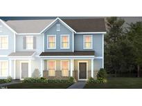 Two-story townhome with gray siding, brick accents, and landscaping at 385 Fosterton Cottage Way, Raleigh, NC 27603