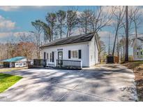 Charming one-story home with a spacious deck and long driveway at 164 Pinto Dr, Louisburg, NC 27549