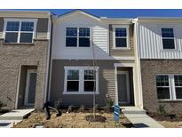 Modern two-story townhome with brick and siding exterior at 2052 Glen Crossing Dr, Durham, NC 27704