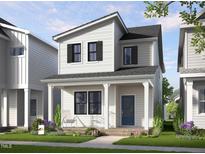 Charming two-story home with white siding, a cozy front porch, and a well-maintained lawn at 354 Cottage Hill Way, Raleigh, NC 27604