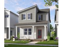 Charming two-story home with a welcoming front porch and red front door, perfect for relaxing at 942 Allen Park Dr, Knightdale, NC 27604