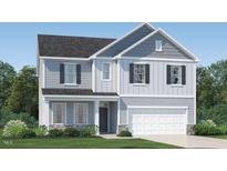 Two-story house with gray siding, white trim, and a two-car garage at 609 Morning Light Dr, Angier, NC 27501