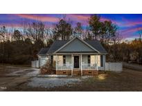 Charming single-story home with a welcoming front porch, perfect for relaxing evenings at 10 Saddletree Dr, Franklinton, NC 27525