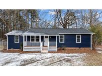 Newly renovated blue house with white porch and steps at 303 N Gaylee Lake Dr, Wendell, NC 27591