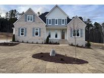 Charming, newly built two-story home with a neatly landscaped front yard at 3803 Bennett Grove Dr, Wake Forest, NC 27587