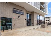 Apartment building entrance featuring modern architectural details and clear signage at 523 S West # 305, Raleigh, NC 27601