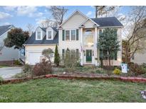 Two-story house with a green door, and nicely landscaped front yard at 1203 Bishopton Way, Knightdale, NC 27545
