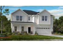 Two-story farmhouse-style home with white siding, stone accents, and a two-car garage at 2012 Clydner Dr, Apex, NC 27523