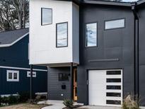 Modern two-toned exterior with attached garage and walkway at 705 Colleton Rd, Raleigh, NC 27610